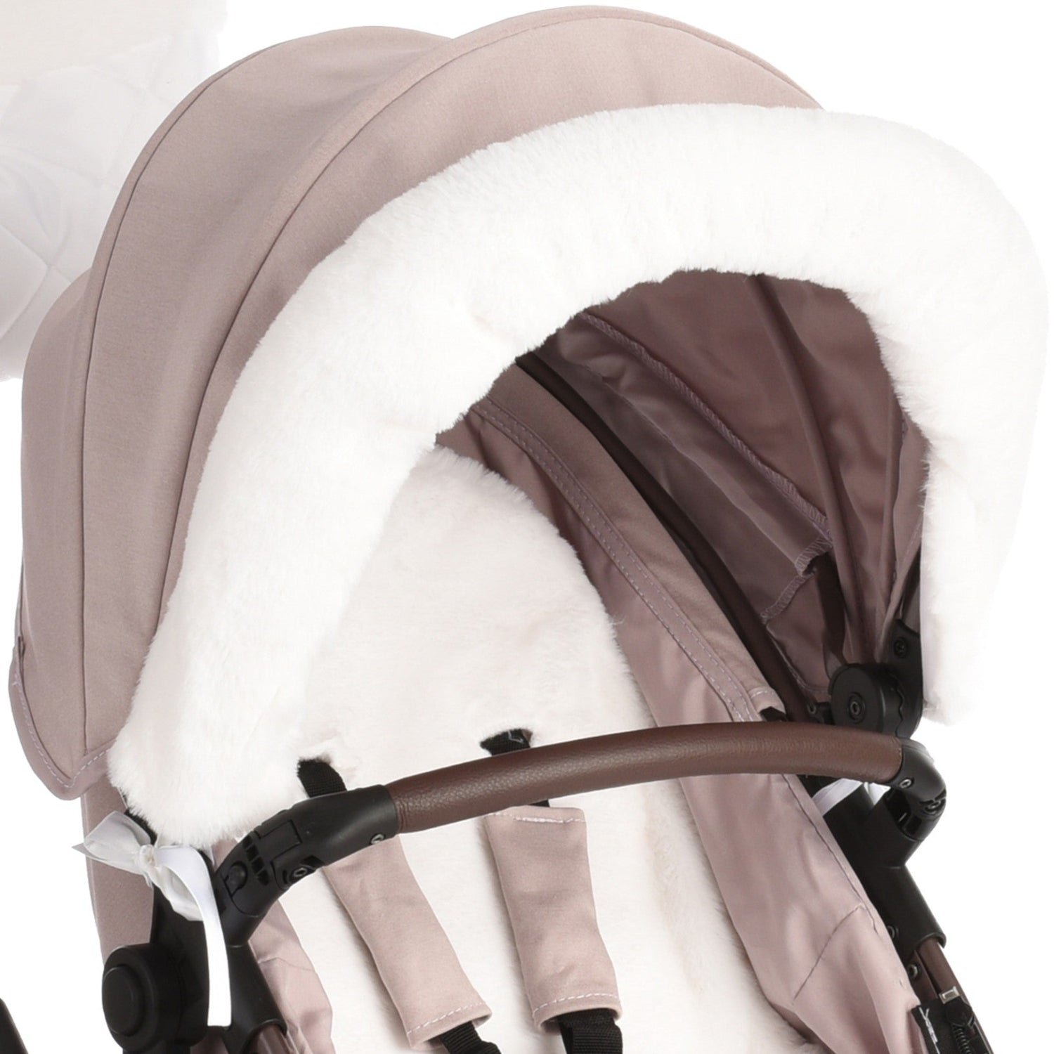 Close-up of a stroller hood in a dusty blush pink fabric with a thick white faux-fur trim and lining, attached to a stroller frame with a brown handlebar.