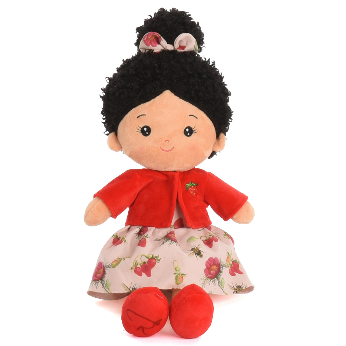 A plush doll with black curly hair, a red cardigan, and a strawberry-print skirt, shown against a plain white background.