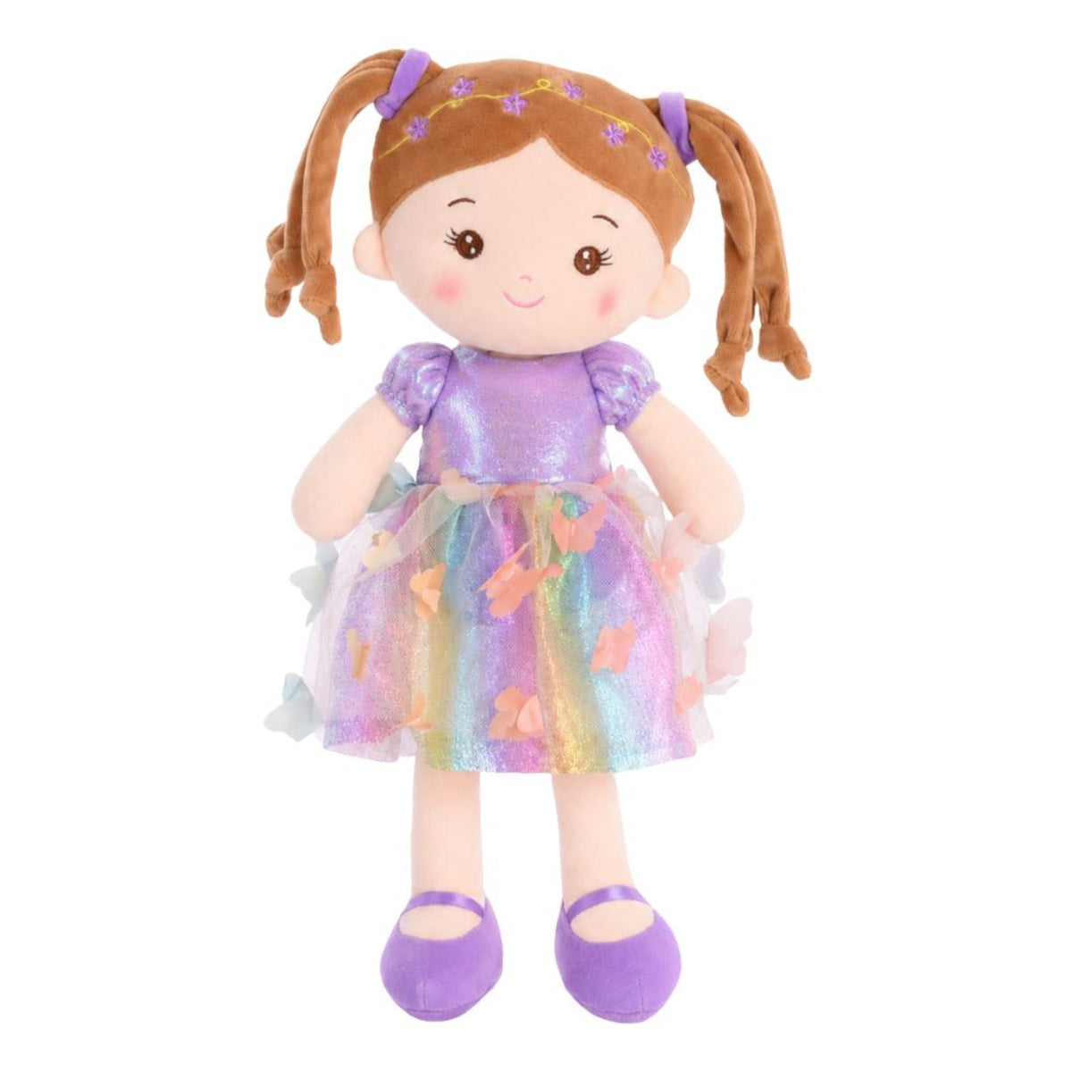 A plush doll with brown pigtails, a purple glittery top, and a pastel rainbow tulle skirt decorated with butterfly appliqués, standing against a plain white background.